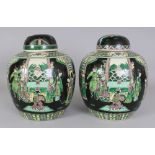 A PAIR OF 19TH CENTURY CHINESE FAMILLE VERTE PORCELAIN JARS & COVERS, each base unglazed, 8.25in