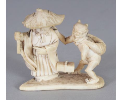 SIGNED JAPANESE MEIJI PERIOD IVORY NETSUKE OF A MAN & AN ONI, the man wearing a wide brimmed hat, the base with an engraved s