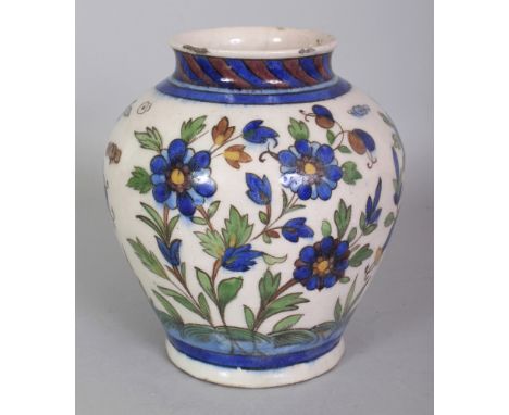 A PERSIAN ISNIK STYLE CERAMIC VASE, the base unglazed, 7.1in high.