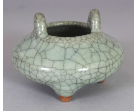 A SMALL CHINESE CELADON CRACKLEGLAZE PORCELAIN TRIPOD CENSER, 3.8in wide at widest point & 2.6in high to top of handles.