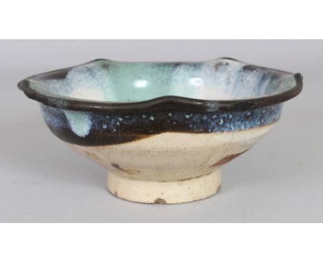 AN UNUSUAL JAPANESE GLAZED CERAMIC BOWL, 7.3in diameter & 3in high.