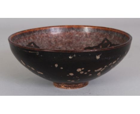 A CHINESE SONG STYLE PAPERCUT DECORATED CERAMIC BOWL, the base unglazed, 6.3in diameter & 2.6in high.