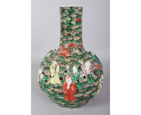 AN EARLY 20TH CENTURY CHINESE FAMILLE VERTE PIERCED & MOULDED IMMORTALS PORCELAIN BOTTLE VASE, the base with a moulded Kangxi