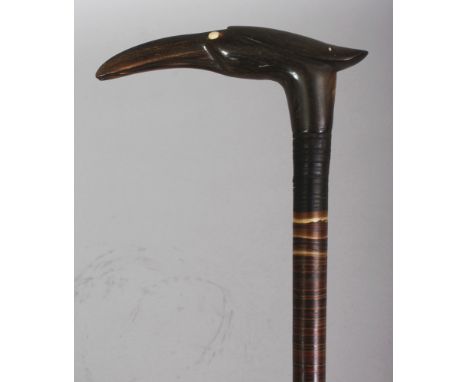 ANOTHER HORN WALKING STICK, possibly partially rhinoceros horn, the shaft formed from graduated variously coloured bands, 33i