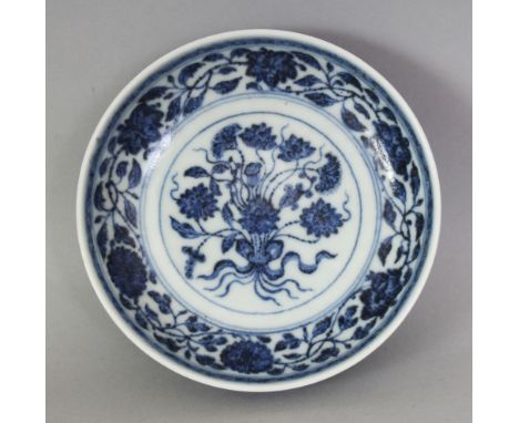 A SMALL CHINESE MING STYLE BLUE & WHITE LOTUS BOUQUET PORCELAIN DISH, the base with a Qianlong seal mark, 4.5in diameter.