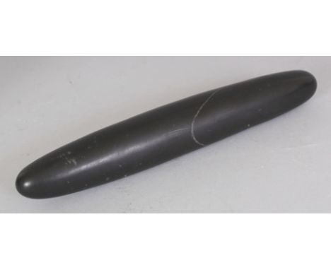 AN UNUSUAL CHINESE BLACK HARDSTONE SCROLL OR PAPER WEIGHT, 9.5in.