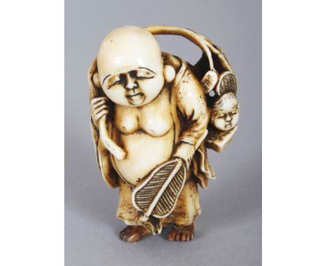 A GOOD QUALITY SIGNED JAPANESE MEIJI PERIOD IVORY NETSUKE OF HOTEI, standing and holding a fan and with various implements an