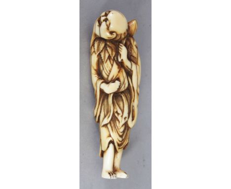 A FINE QUALITY JAPANESE EDO PERIOD IVORY NETSUKE OF A STANDING SENNIN, wearing a leafy mantle and with a gourd slung over his