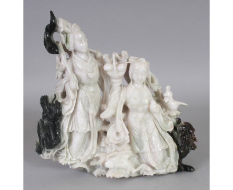 A 20TH CENTURY CHINESE JADE LIKE HARDSTONE CARVING OF TWO FEMALE IMMORTALS, 9.3in wide & 9.25in high.