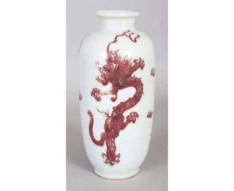 A CHINESE COPPER RED PORCELAIN DRAGON VASE, the base with a six-character Kangxi mark, 8.1in high.