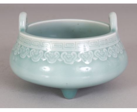 A CHINESE CELADON GLAZED PORCELAIN TRIPOD CENSER, the base with a Qianlong seal mark, 5.1in wide at widest point & 3.25in hig