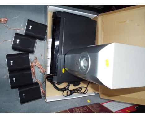 An LG DVD receiver and surround sound model number HT752TH, with remote and instructions part boxed