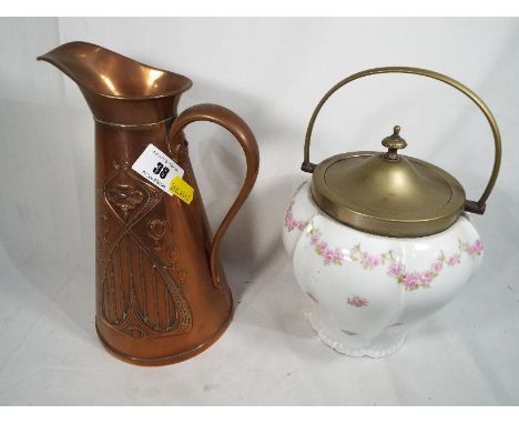 A copper jug decorated in an Art Nouveau design decorated with stylised flowers, the base marked J.S. & S (Joseph Sankey & So