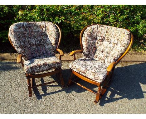 Two stick-back rocking chairs with loose cushion backs and seats - (see also lot 171)