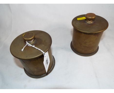 World War One (WWI) trench art - two German shells converted to form lidded cylindrical pots the covers with finials decorate