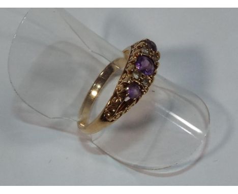 A lady's yellow metal 9ct amethyst and cz ring approx weight 2.5 gm (all in) size L + 1/2, boxed - Est £30 - £40