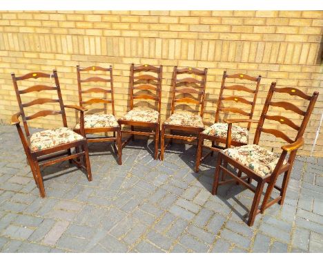 Ercol - two carvers and four dining chairs, ladder back with drop-in upholstered seats and marked to the bases Ercol - includ