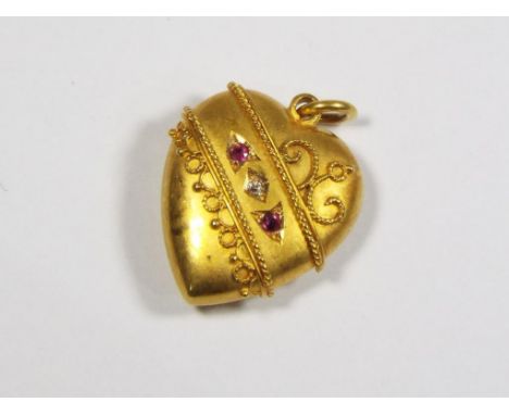 A 15 carat Chester hallmarked ruby and diamond pendant with filigree front, weight approximately 3 grams. Estimate £80 - £100