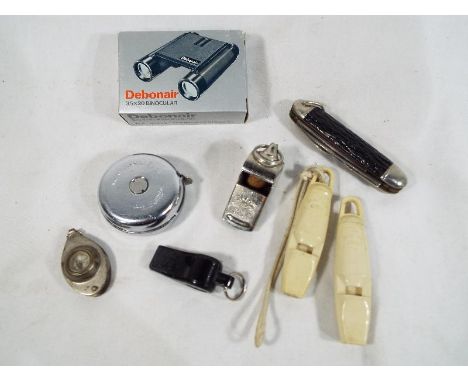 A mixed lot to include a Smiths stopwatch, a pocket knife with blade marked Richards, Sheffield, four whistles, a white metal