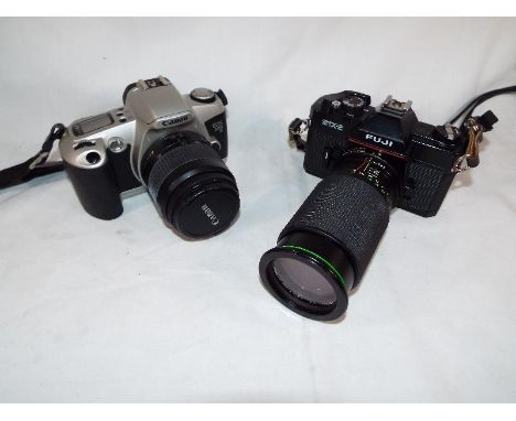 A Fuji STX-2 camera serial no 6081006 with zoom lens, and a Canon EOS 500 serial no 1337520, both with soft cases (2)