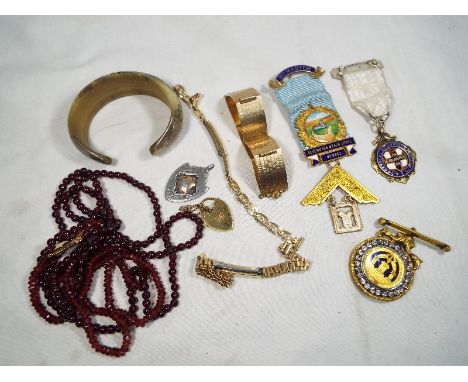 A collection of jewellery pieces to include a Masonic medal, silver and enamel stewart brooch, horn bangle, bracelet, silver 