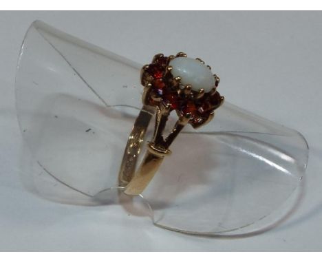 A lady's hallmarked 9ct yellow gold opal and garnet cluster ring approx weight 1.8 gm (all in) size L 1/2, boxed - Est £25 - 