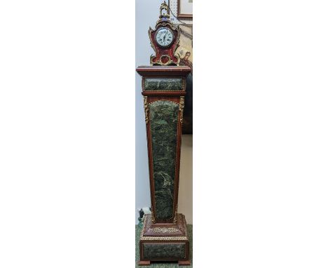 A Louis XV style French inlaid mahogany and Marble torchere on bracket feet and a matched Ormolu bracket clock with roman num