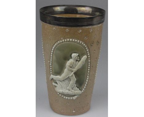 A Royal Doulton Lambeth Ware cricket beaker with a silver plated rim. The three scenes are of cricketers in white relief on a