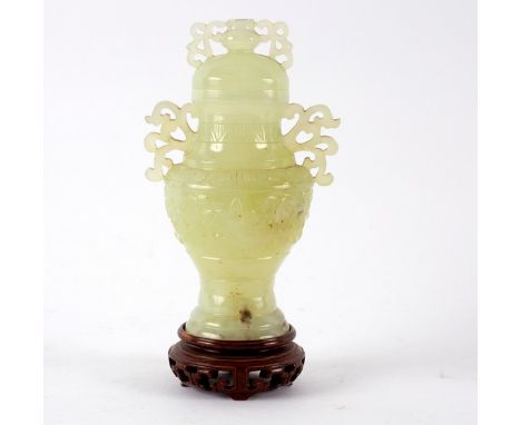 A 20th Century Chinese pale celadon bowenite baluster vase and cover, the domed lid with scroll handle cup finial, the scroll