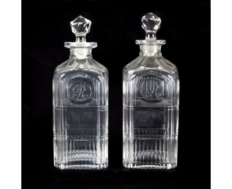 A pair of Georgian glass square cut decanters with canted corners and prism shaped stoppers, monogrammed R, 24cm high/see ill