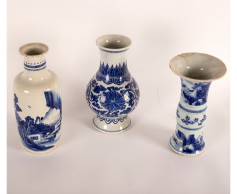 A Chinese rouleau vase, Kangxi, decorated a coastal landscape, 25.5cm high(damaged) a Chinese blue and white baluster vase, K