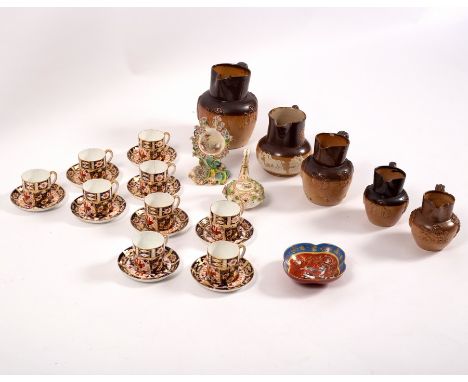 Nine Royal Crown Derby coffee cans and saucers, five brown glazed jugs with relief decoration and sundry china