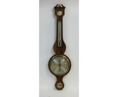 A 19th Century wheel barometer by C Camozzi, Bicester, fitted a dry/damp dial, thermometer, dial with scale from 28-31 and a 