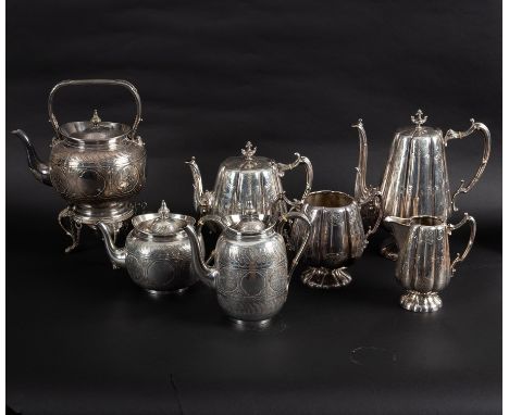 A silver plated tea kettle, the matching teapot and hot water jug and another plated tea service CONDITION REPORT: The spout 