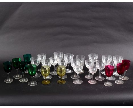 Five stem wine glasses with green tinted bowls, three others with ruby tinted bowls and other sundry glasses