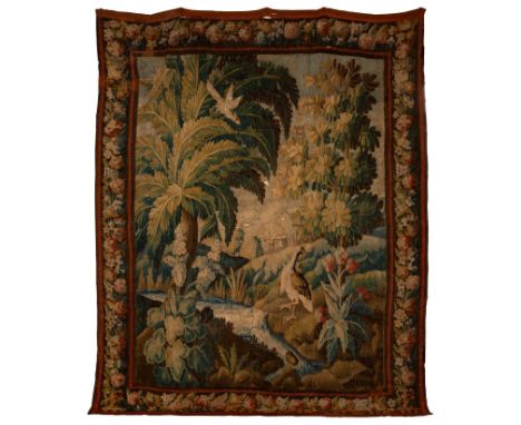 A late 17th/early 18th Century Flemish Verdure tapestry, depicting a bird of paradise in a tropical setting, 270cm x 228cm/se