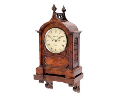 A Victorian walnut cased bracket clock the circular dial signed Wymark &amp; Son, London, the case of Gothic design with bud 