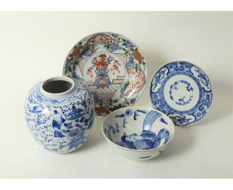 A 20th Century Chinese ginger jar, apocryphal Kangxi marks to base, the sides decorated in blue with figures, vases, birds an