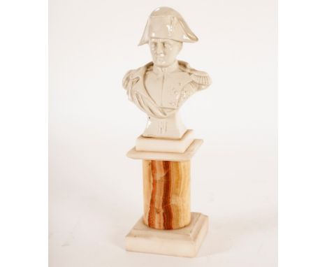 A ceramic bust of Napoleon, on agate plinth, impressed number 2327 and with imitation Naples mark, 23.5cm high 