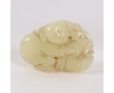 A Chinese pale celadon jade carving, boy with a basket, 5cm wide CONDITION REPORT: Good condition