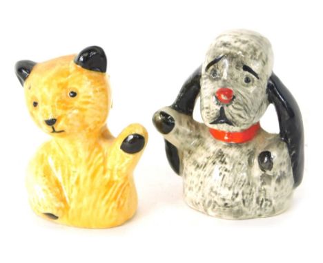 A pair of pottery figures, Sooty and Sweep, 6cm high, with card written: The Figures Were Given Away by Harry Corbett and Are