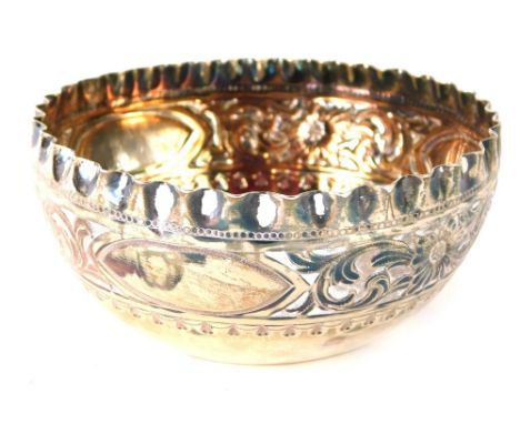 A Victorian silver sugar bowl, with an embossed and repousse decoration of flowers, scrolls, etc., Sheffield 1891, 2.42oz.