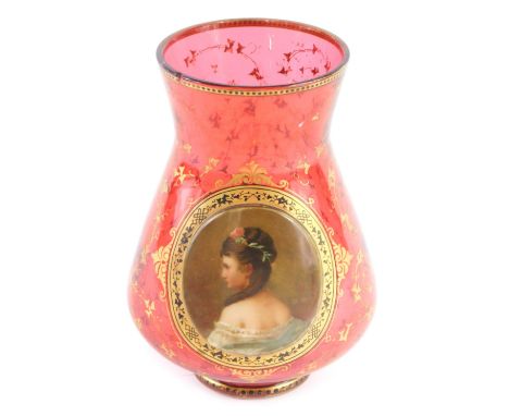 A Bohemian ruby tinted glass vase, with applied plaque painted with a lady in profile, within gilt leaf borders (AF), 16cm hi