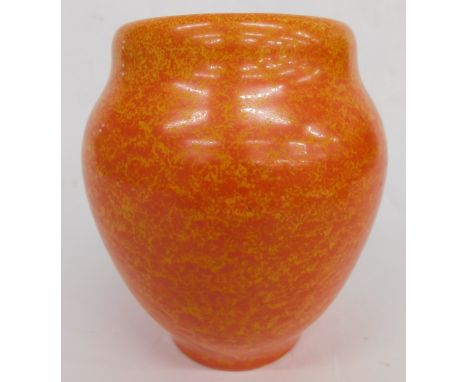 A Royal Lancastrian pottery orange vase, by Radford, vibrantly decorated with a speckle glaze, on circular foot, impressed ma