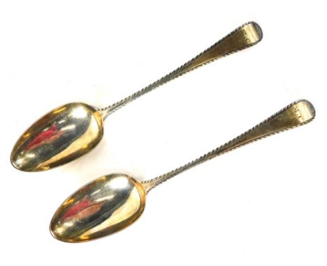 A pair of George III silver spoons, old English pattern, with feathered borders, initialled MC, 18thC, marks indistinct, 3.49