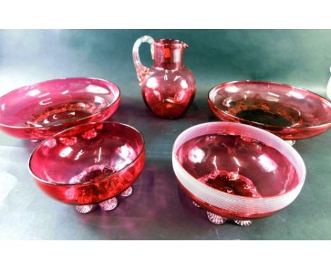 Various cranberry and ruby glassware, bowl, 14cm diameter, two various other bowls, a jug with plain glass strap work handle,