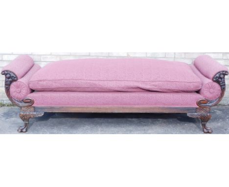 A 19thC style mahogany scroll arm sofa or day bed, with fruit carved show-frame, and scroll feet, double sided with squab, 21