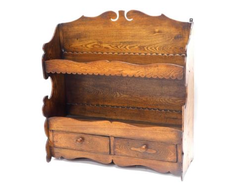 A 19thC elm wall shelf, with a shaped crest, above two shelves each with a gallery, and two frieze drawers, 67cm high, 63cm w