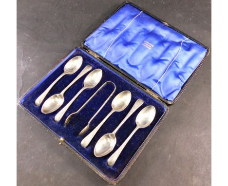 A set of six George V silver teaspoons and matching sugar tongs, each with bright cut decoration of flowers and leaves, Sheff