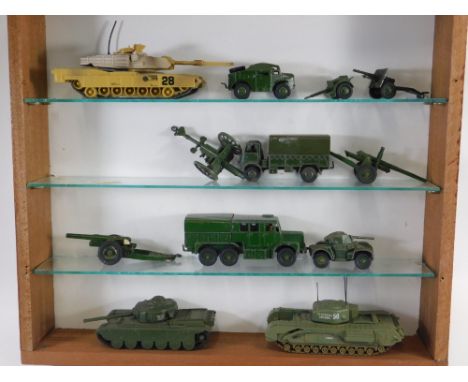 A glazed display cabinet, containing various Dinky and other diecast army trucks, etc., the cabinet 47cm wide.